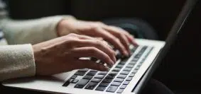 person using laptop